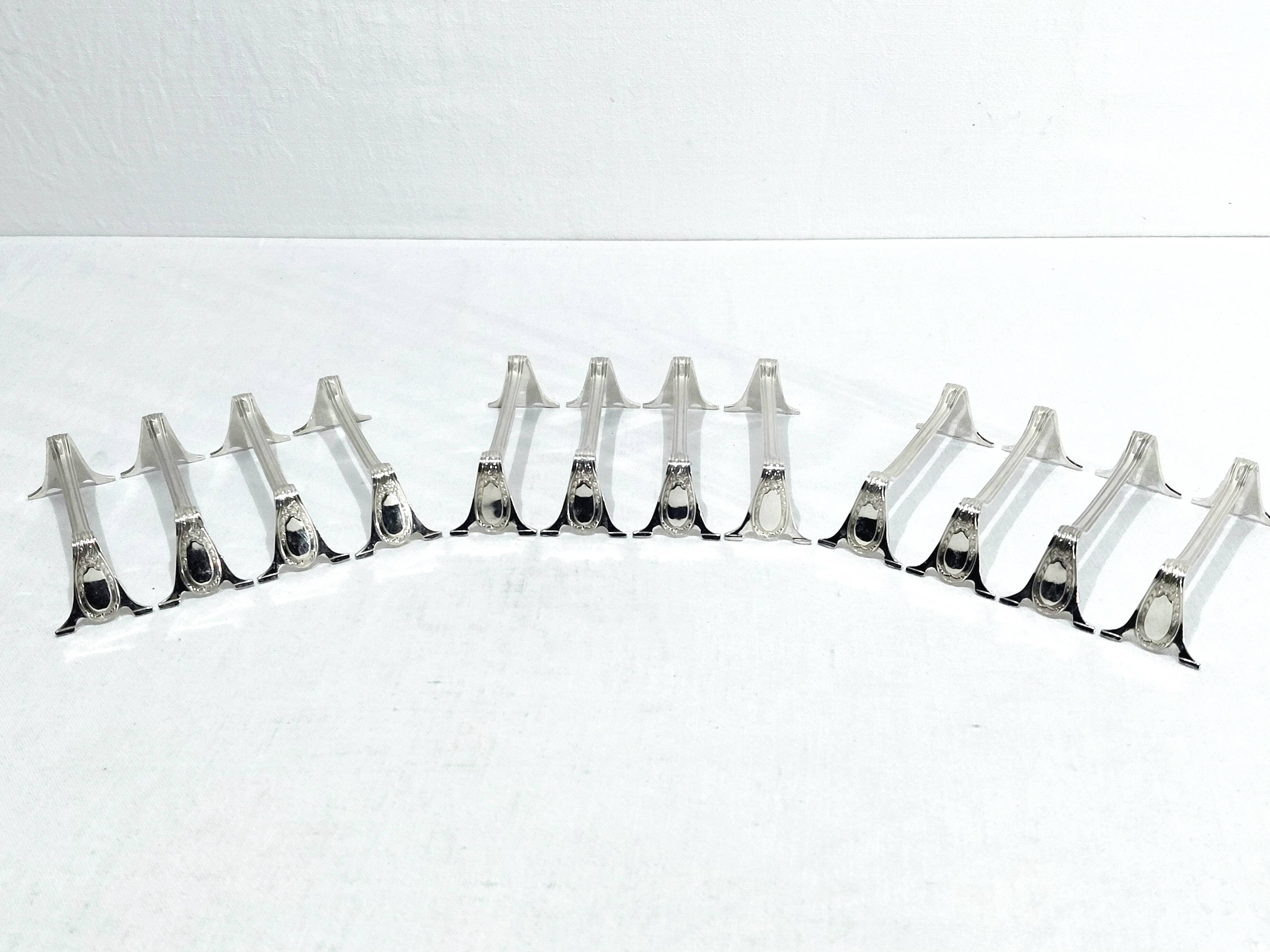 12 silver-plated metal knife rests in empire style