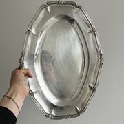 oval silver metal plate