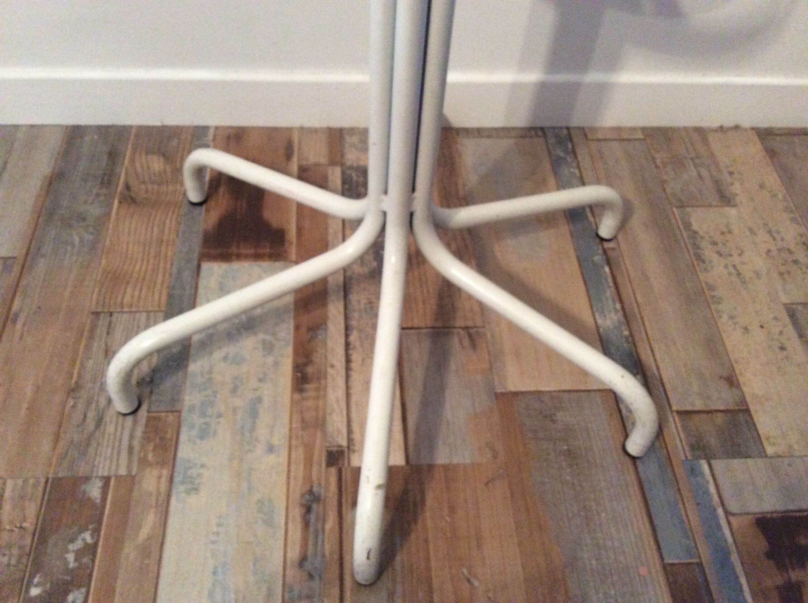 Vintage metal coat rack on foot