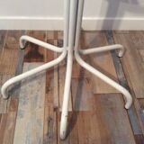 Vintage metal coat rack on foot