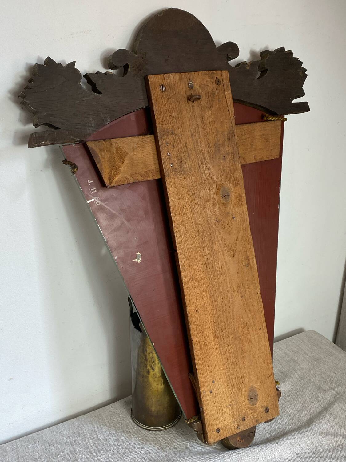 Antique wooden mirror with an unusual shape