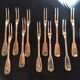12 snail forks, silver metal