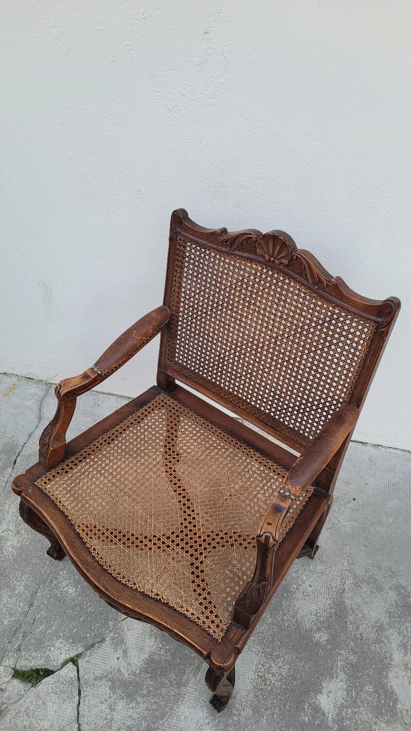 Louis XV Regency cane armchair leather armrests decorated with shell