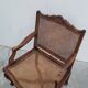 Louis XV Regency cane armchair leather armrests decorated with shell