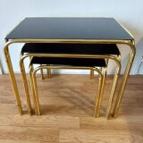 Vintage 1970 gold metal nesting tables.