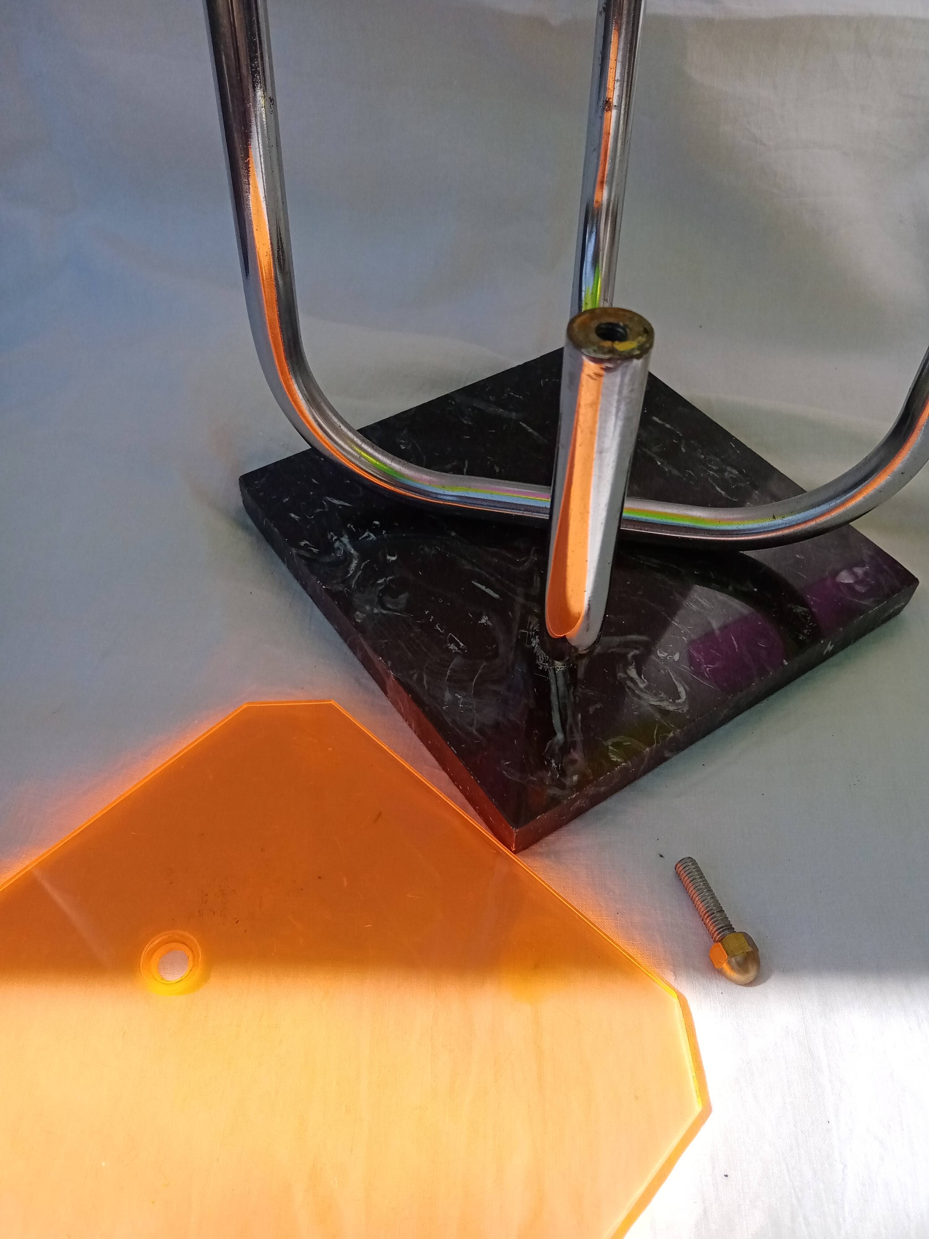 Display shelf with plexiglass trays in 1970s colours.