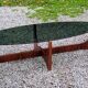Designer coffee table by Hugues Poignant in rosewood and smoked glass from the 70s