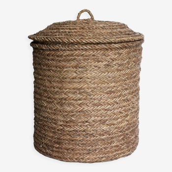 Hand-woven laundry basket in natural rush