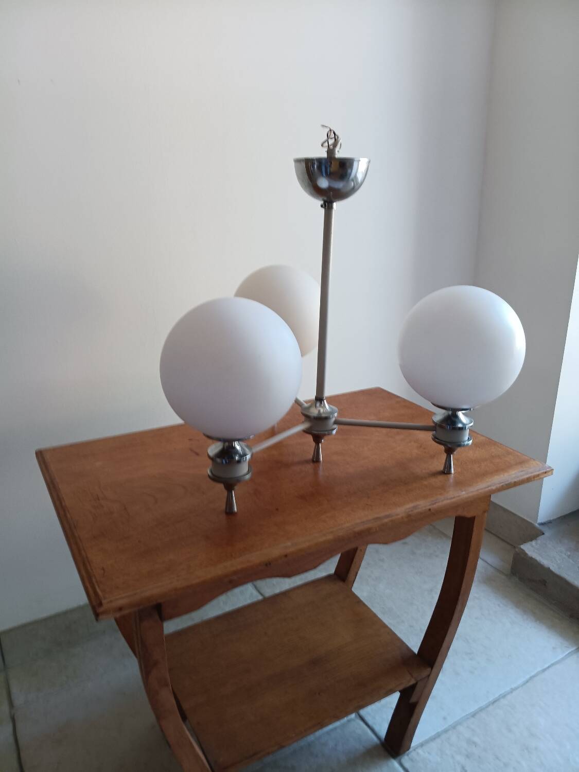 White ball and metal chandelier