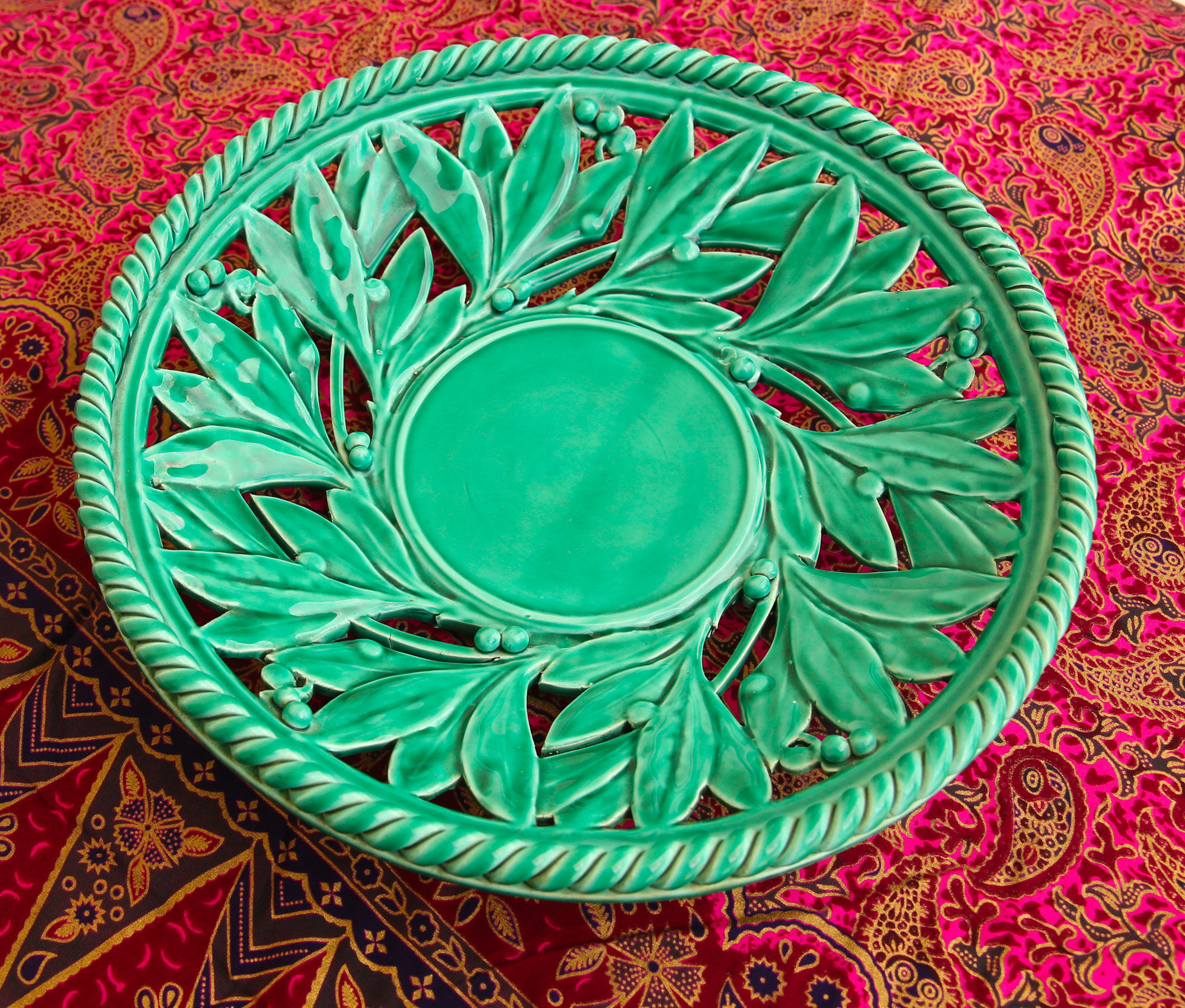 Openwork XL dish in green slurry like olive branches