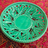 Openwork XL dish in green slurry like olive branches