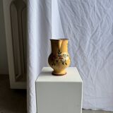 Large antique handmade ochre yellow jug with a pink flower pattern.