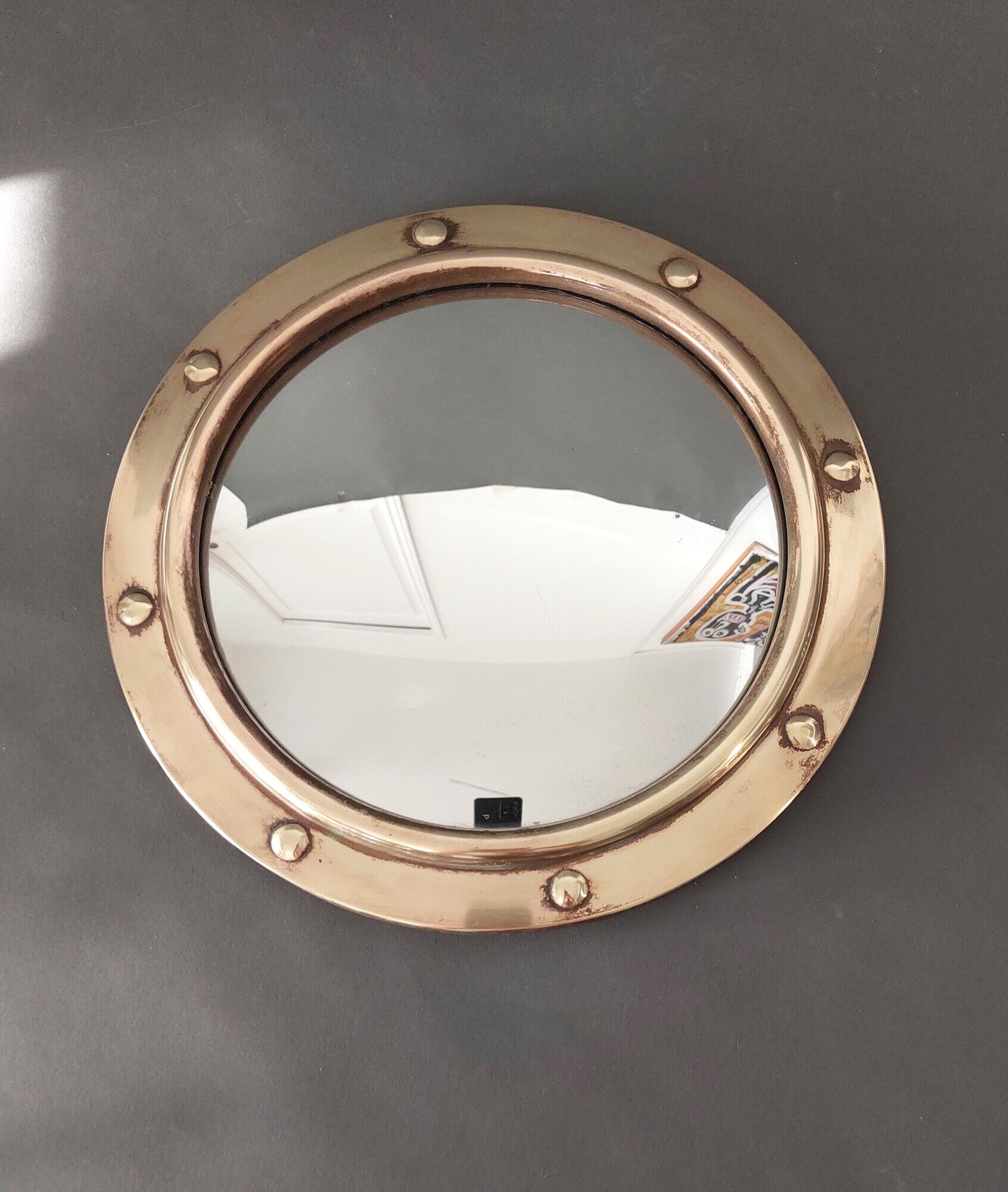 Witch porthole mirror 1940 in vintage gilded brass.