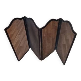 Metal fireplace screen made up of four leaves