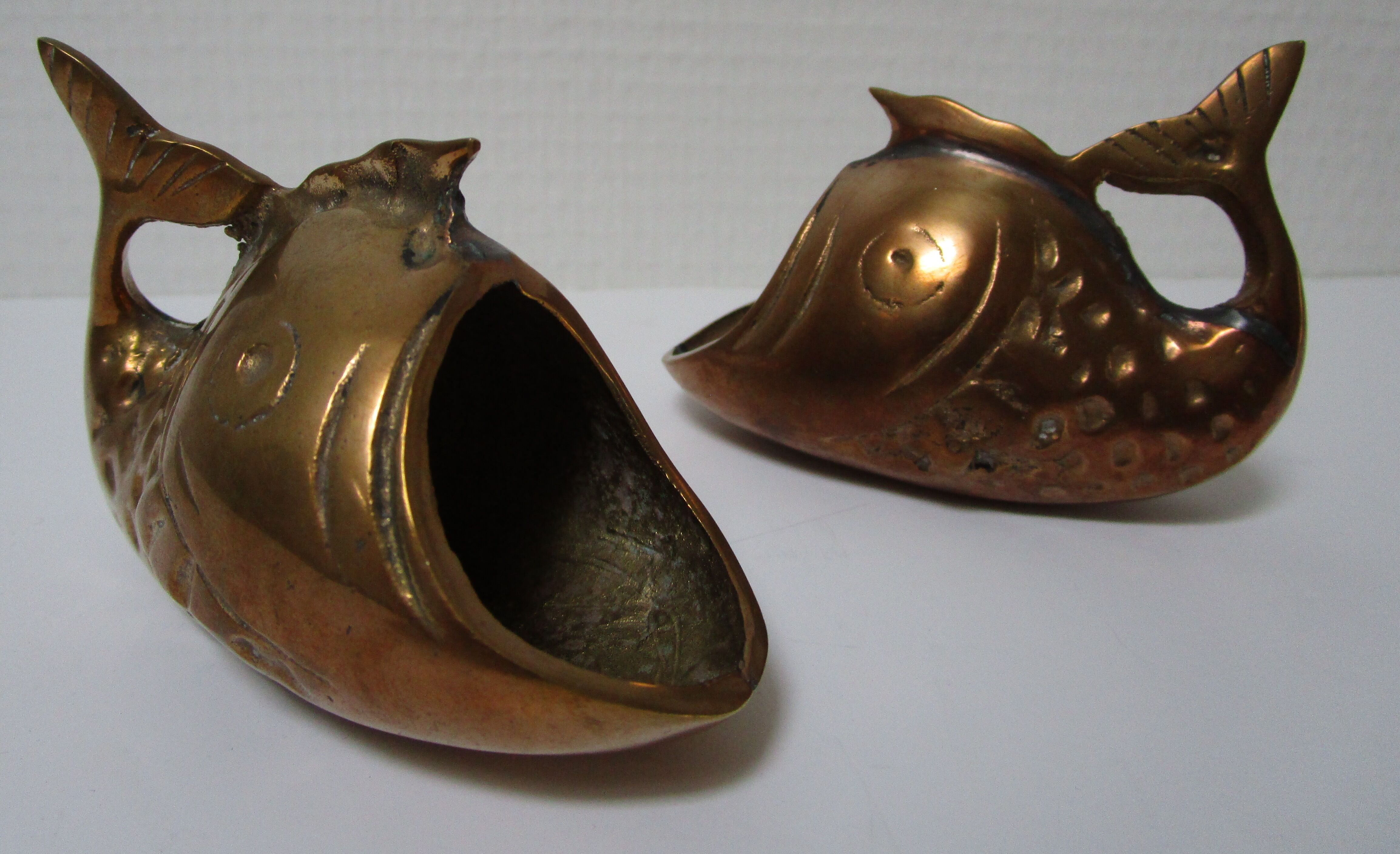 Two vintage brass fish ashtrays