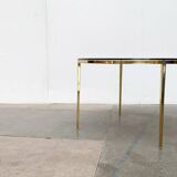 Mid-century Hollywood Regency style coffee table in brass and glass, made in Germany by Vereinigte Werkstätten, 1960s.