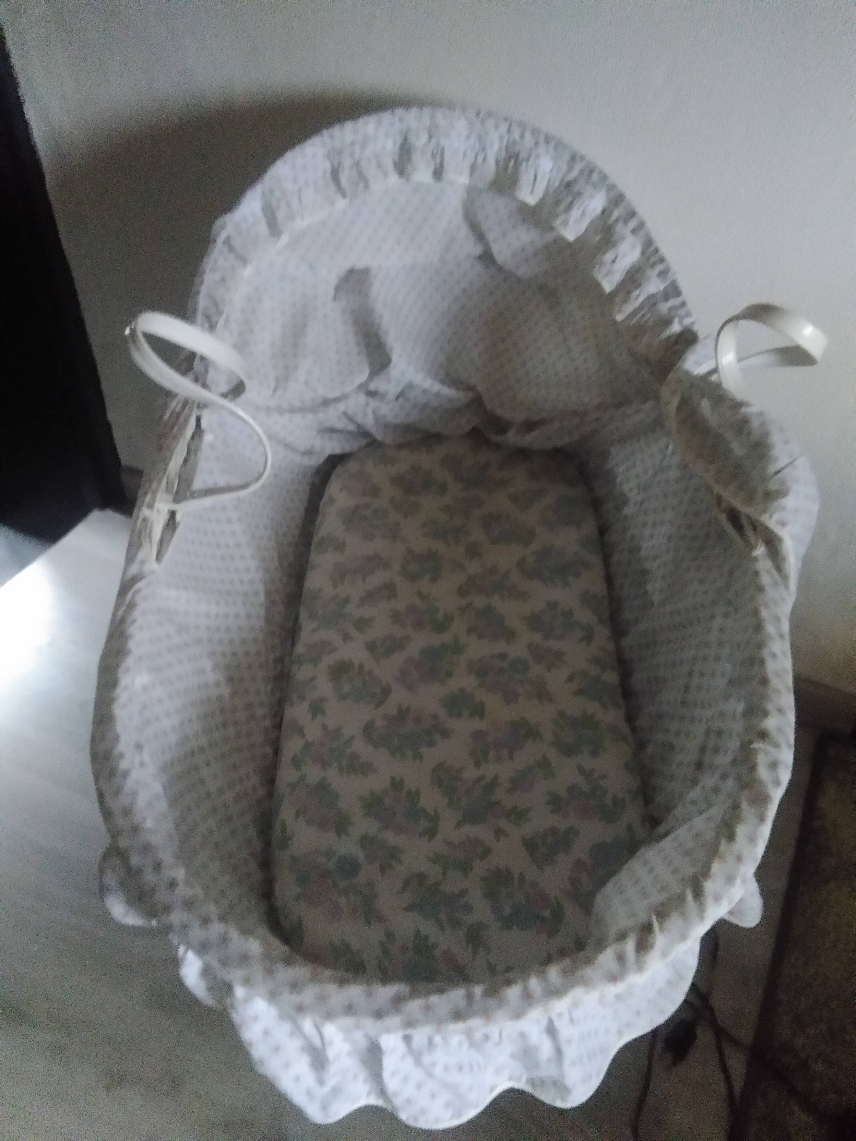 White rattan bassinet