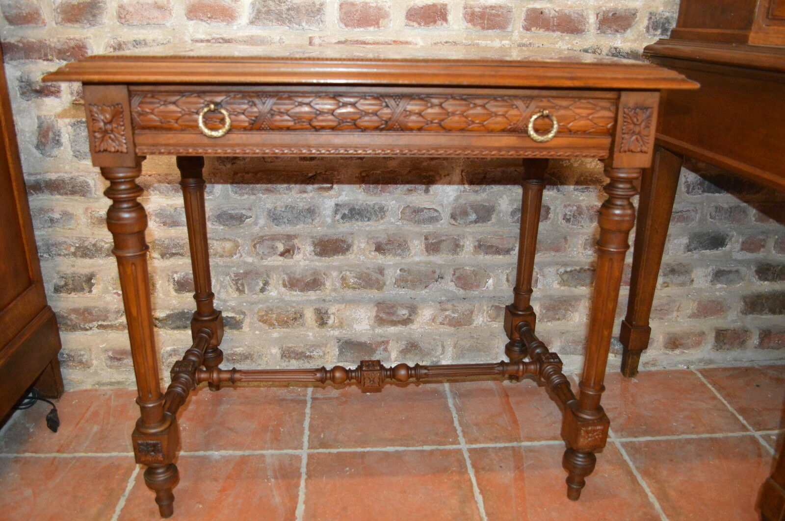 Walnut table with marble top and one drawer