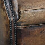 Unique large sheepskin Chesterfield wingback armchair in English style