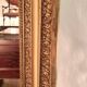 Miroir époque Restauration en bois doré à la feuille