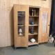 Glass-fronted school cabinet in raw oak