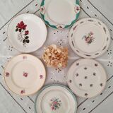 7 mismatched antique dessert plates accompanied by a pie dish