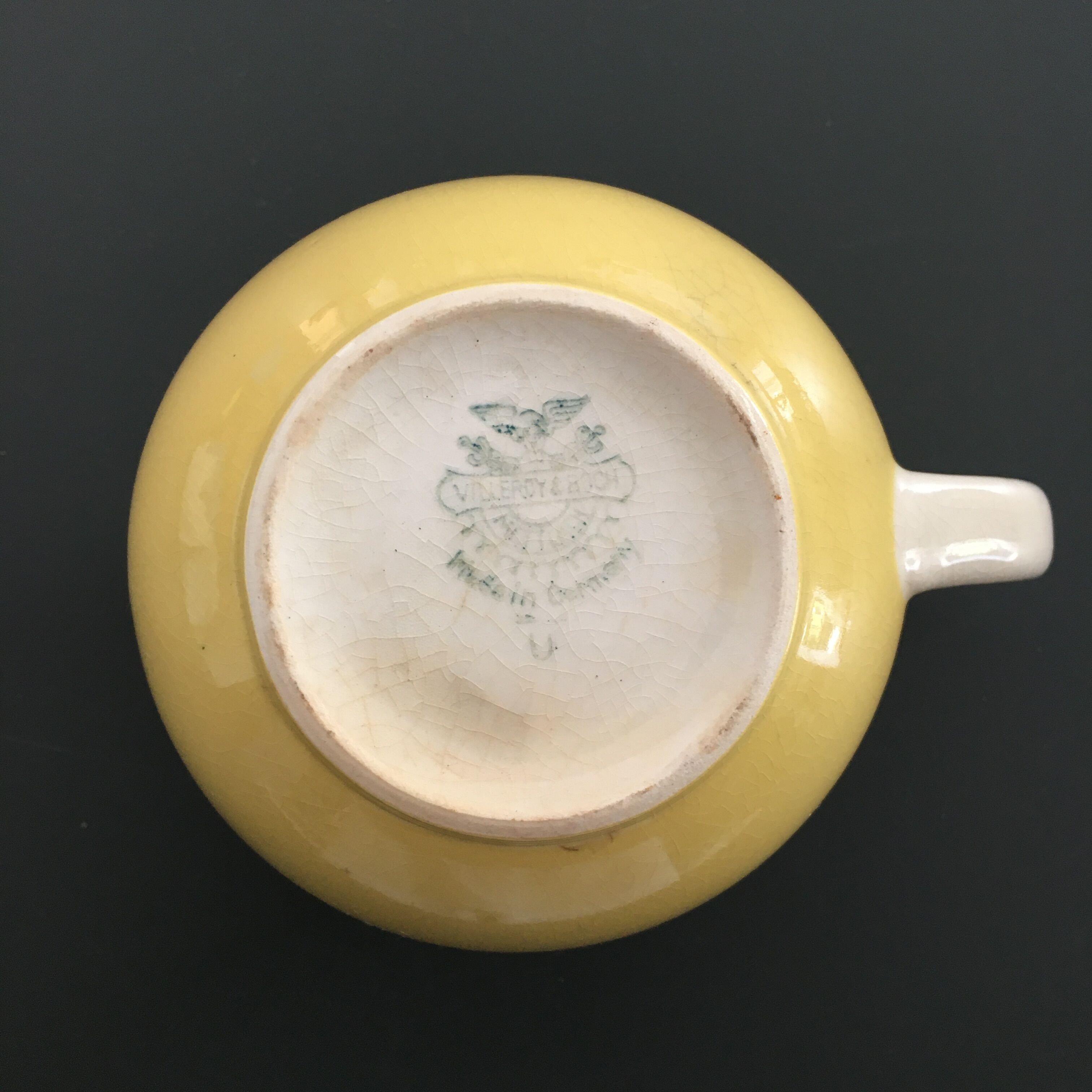 Yellow straw and ivory pitcher