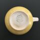 Yellow straw and ivory pitcher