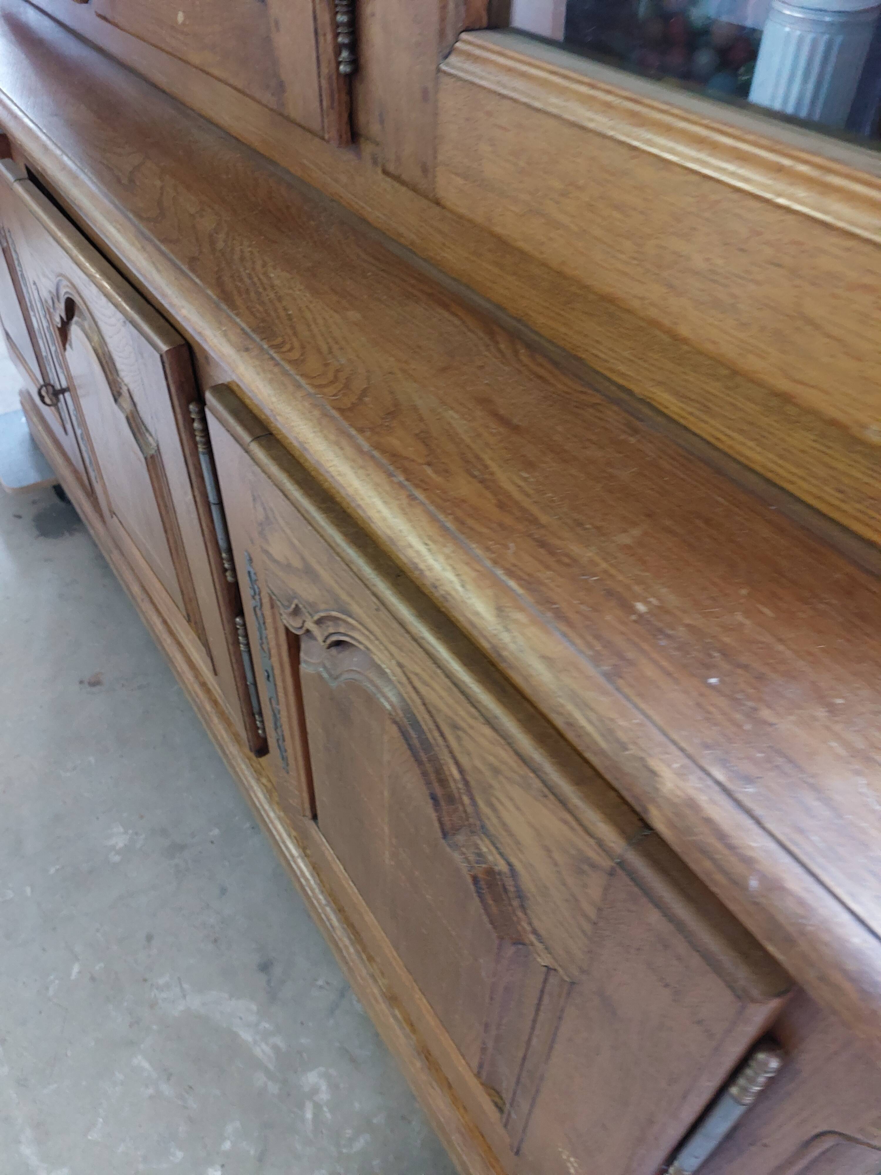 Showcase library with two sections in solid oak.