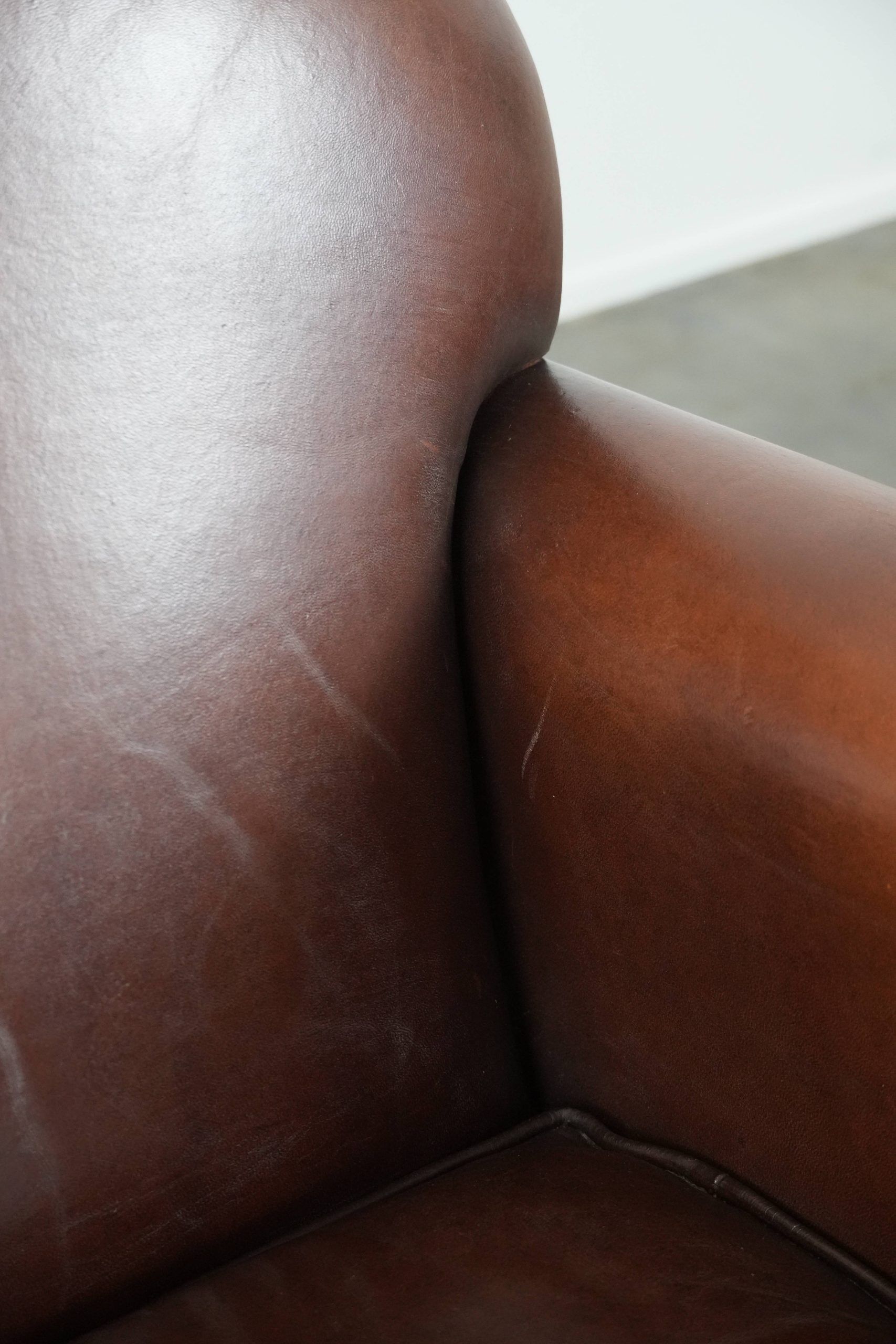 Sheepskin art deco design armchair with timeless and warm colours