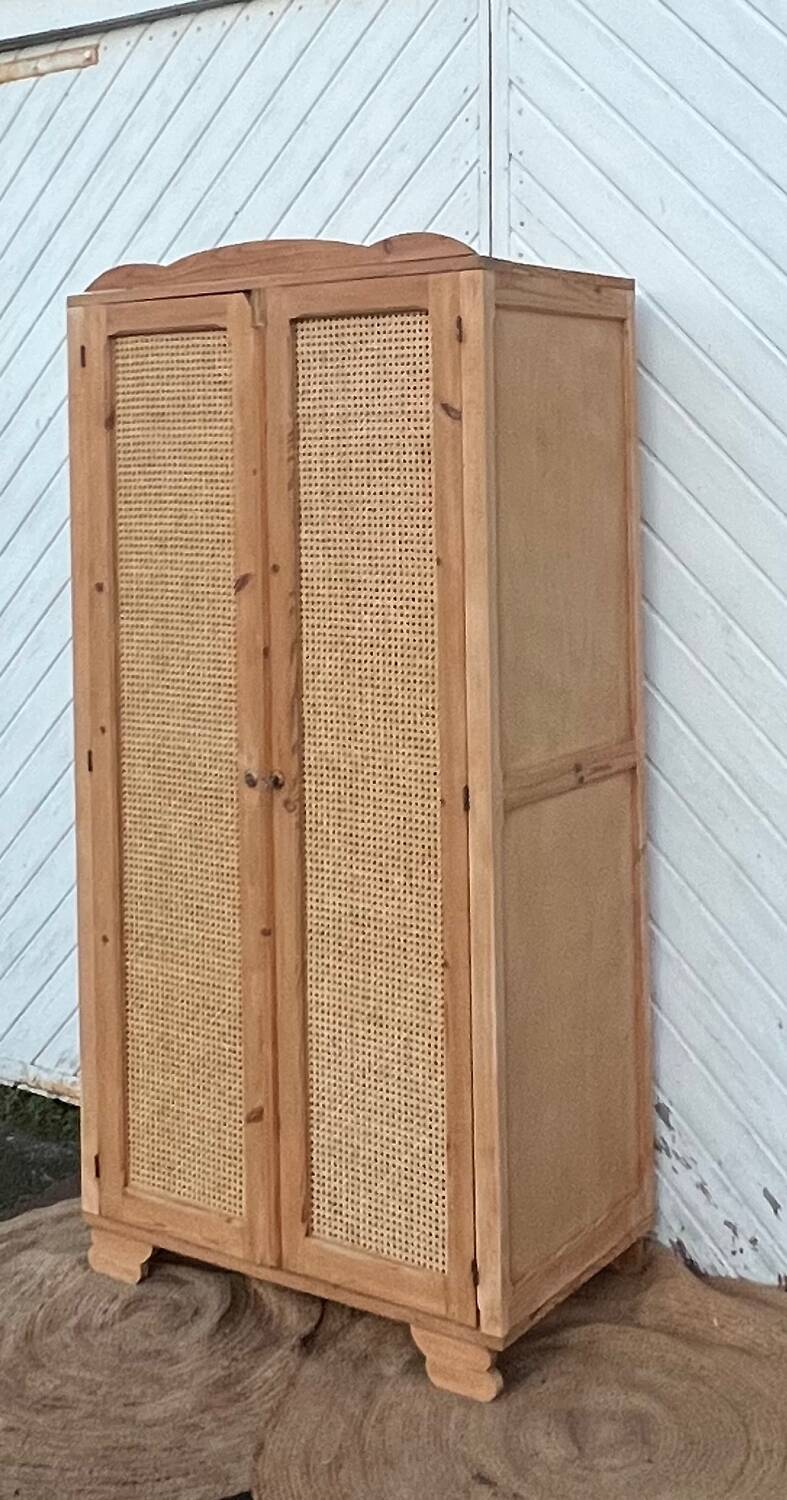 Renovated antique wardrobe in raw wood and caning.