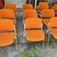 Sérié 39 chaises 4 fauteuils DSC 106 en tissu orange par Giancarlo Piretti pour Castelli