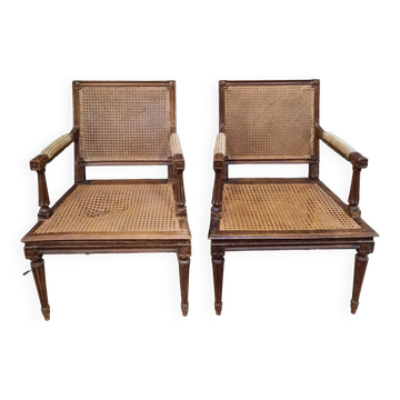 Paire de fauteuils canné de style Louis XVI