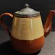 Beige and brown earthenware teapot with pewter lid, early 20th century