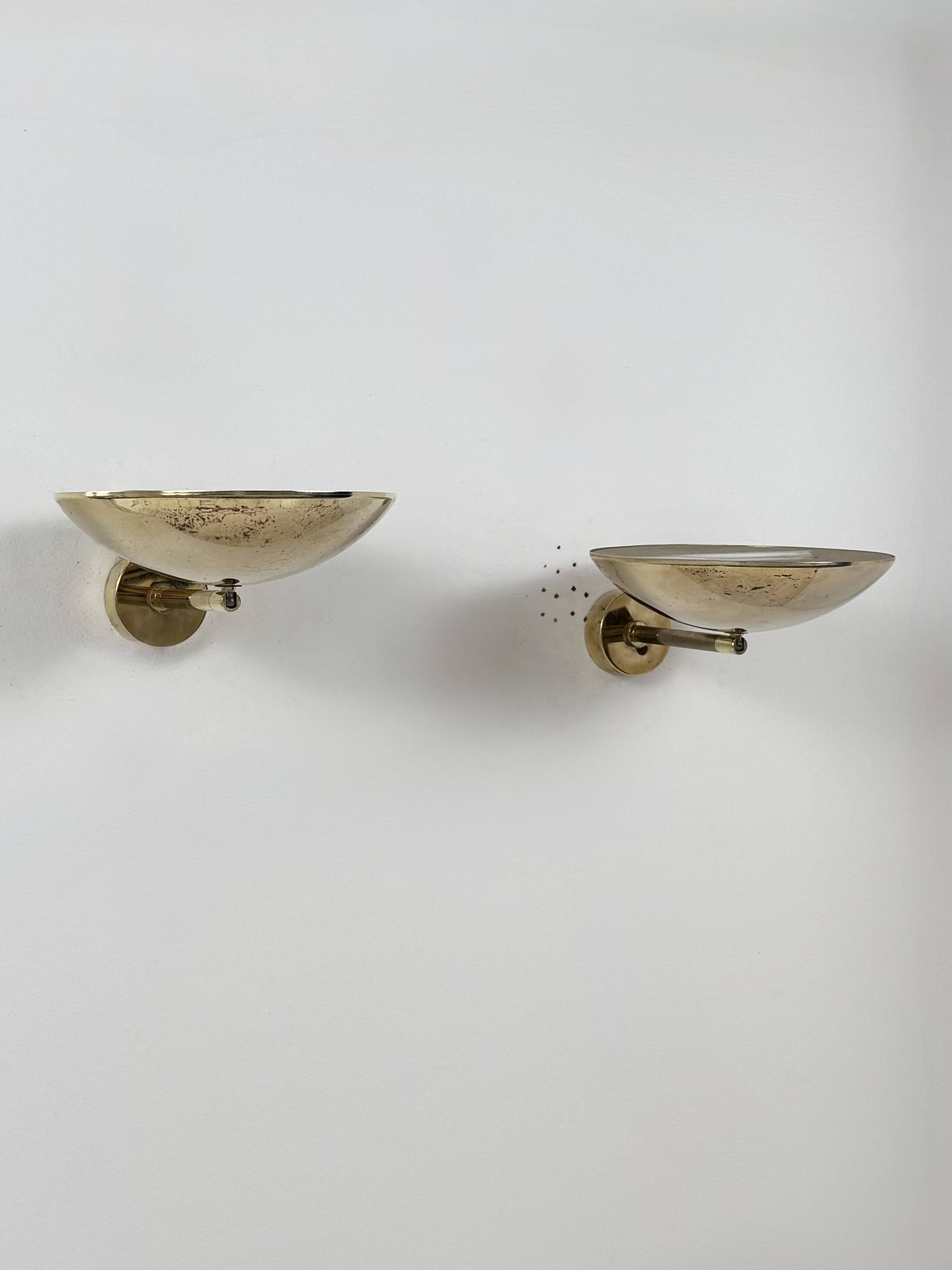 Pair of adjustable vintage wall lights, patinated brass, France, 1970.