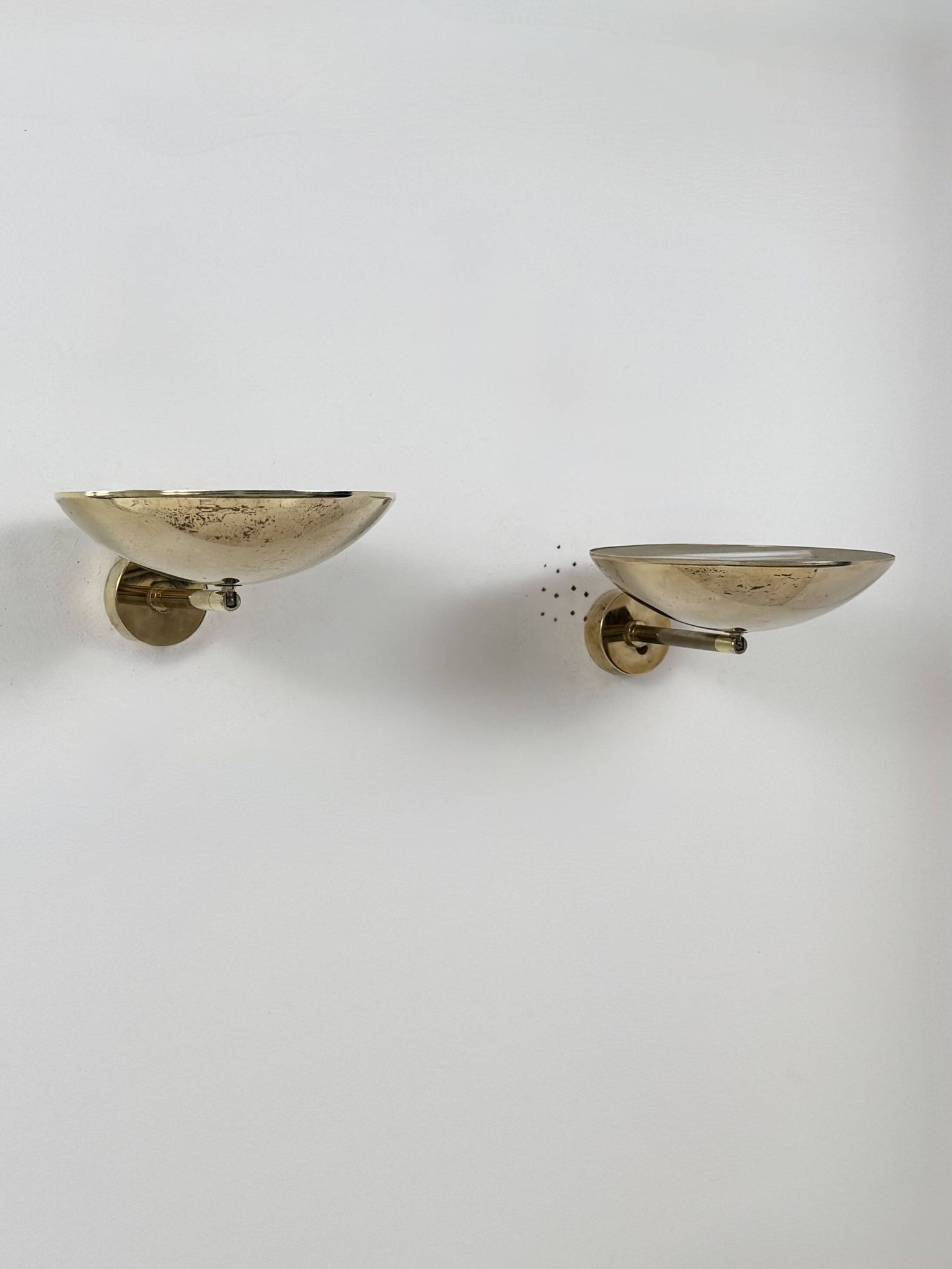 Pair of adjustable vintage wall lights, patinated brass, France, 1970.