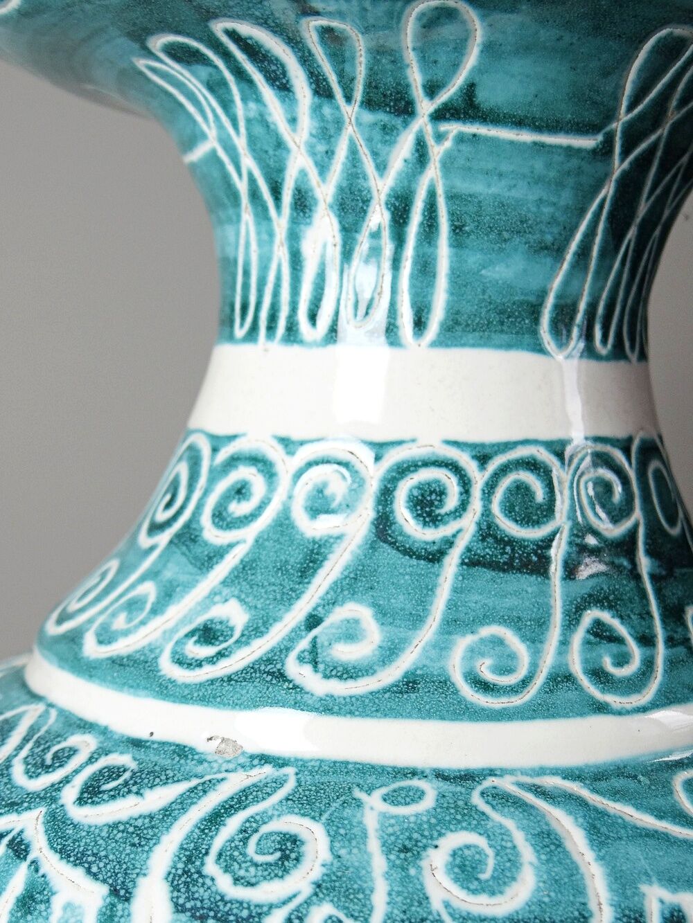 Vintage turquoise ceramic baluster vase with incised decoration.
