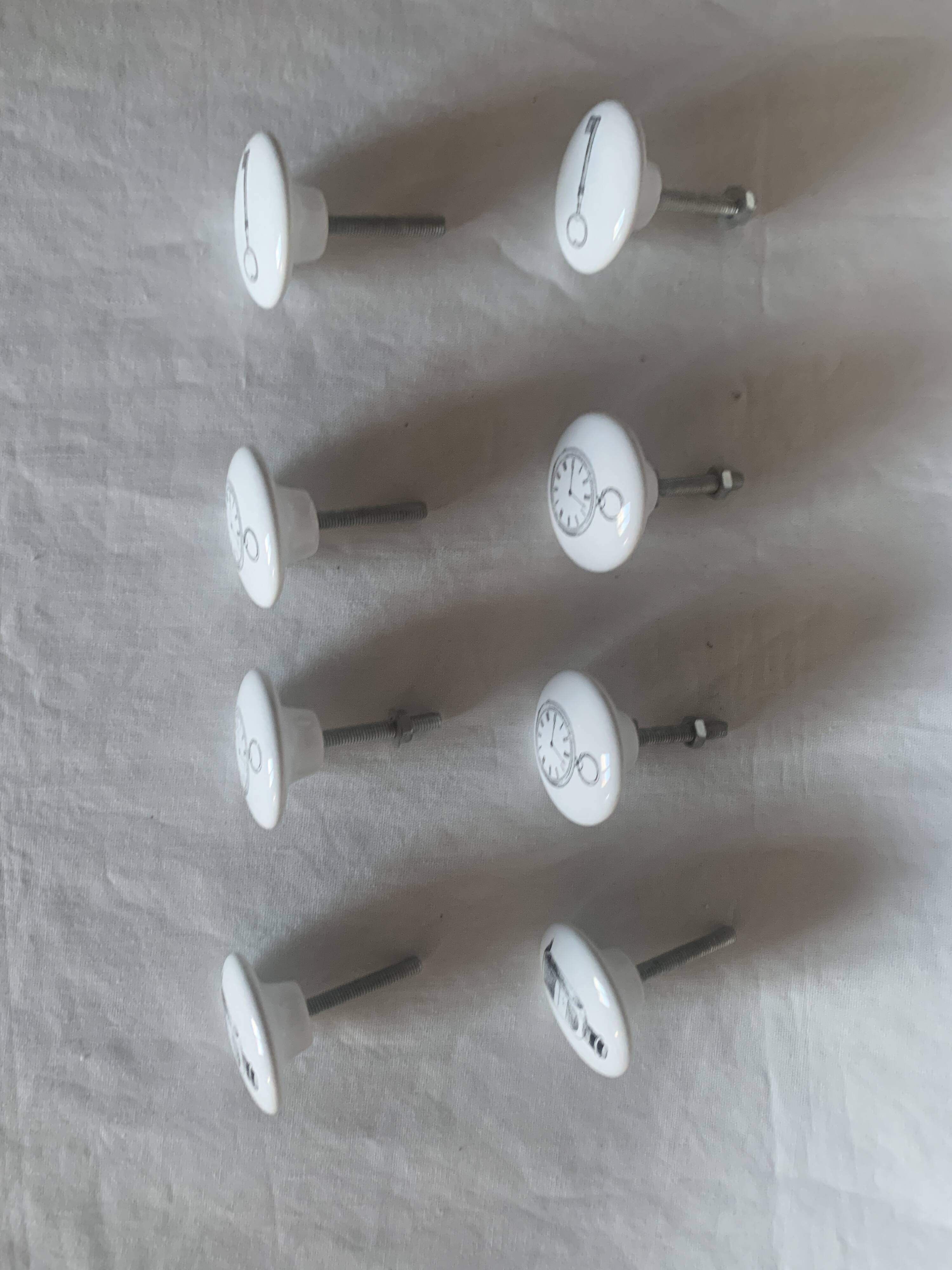 white ceramic door knobs with illustration