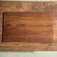 Rectangular solid teak tray with carved edges 40x25