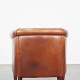Cognac-colored cow leather club chair finished with decorative nails in English style