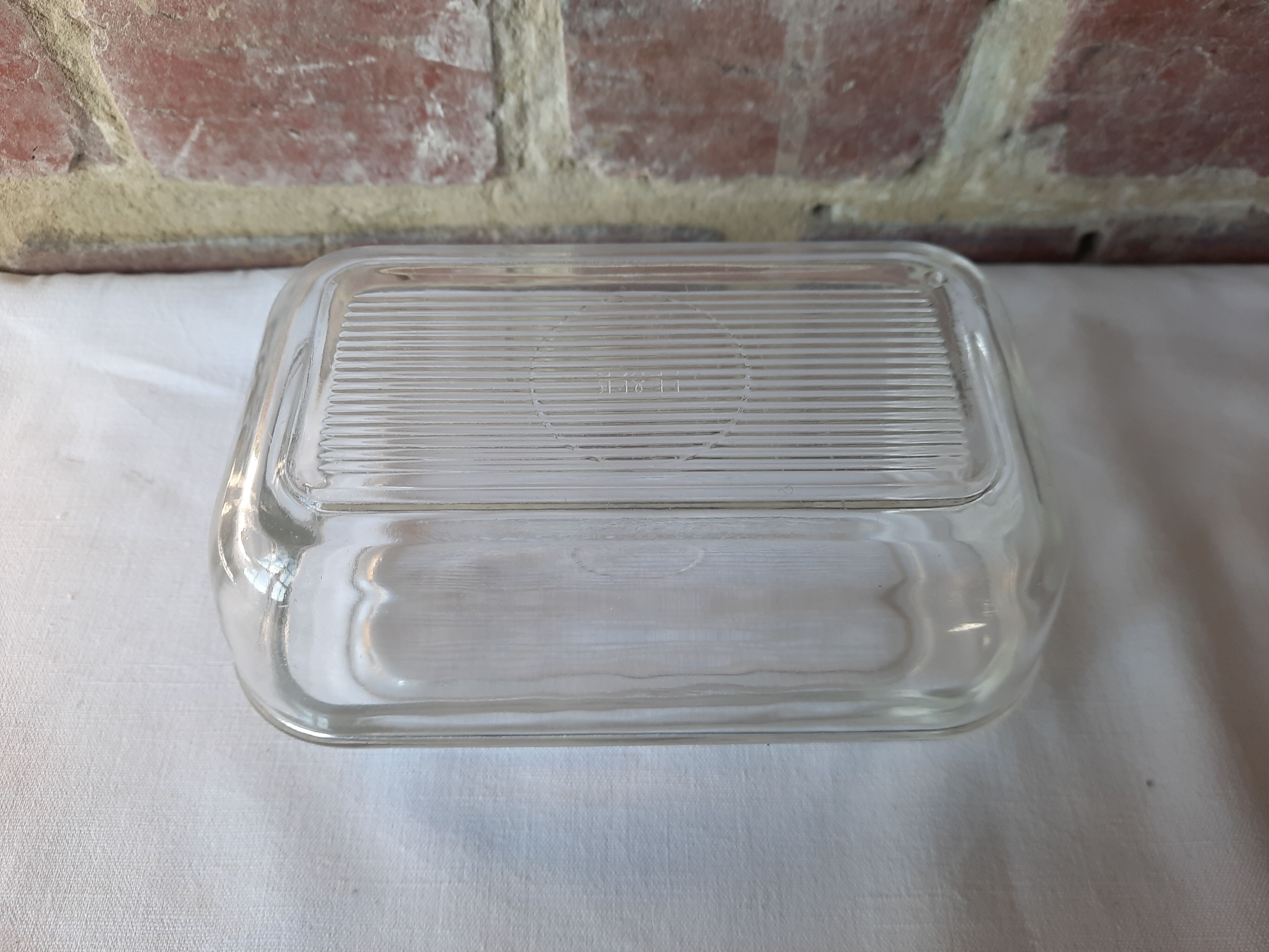 Transparent glass butter dish from lever