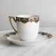 7 Limoges porcelain cups and saucers with gold decoration and floral motif.