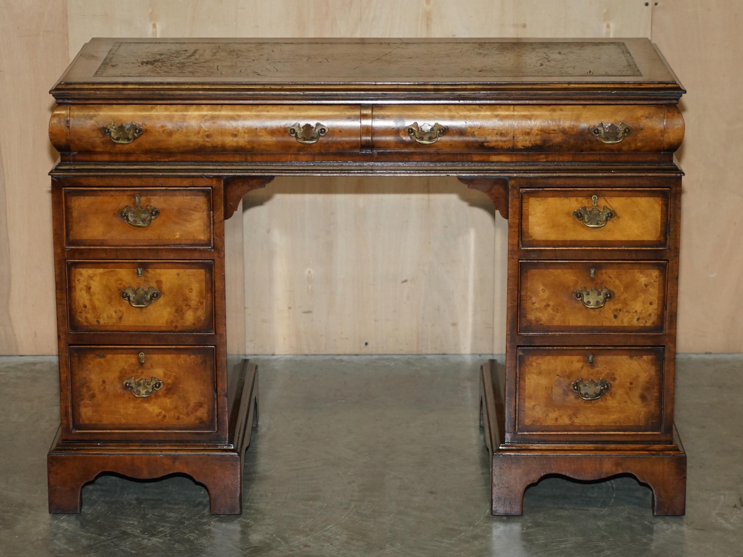 Victorian antique partner's desk in veined walnut with a leather top.
