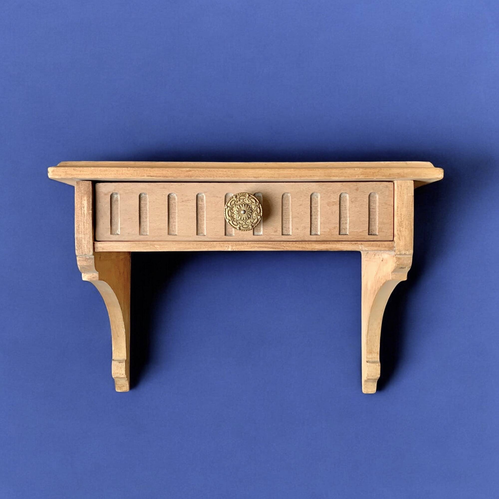 Old small hanging shelf in solid wood