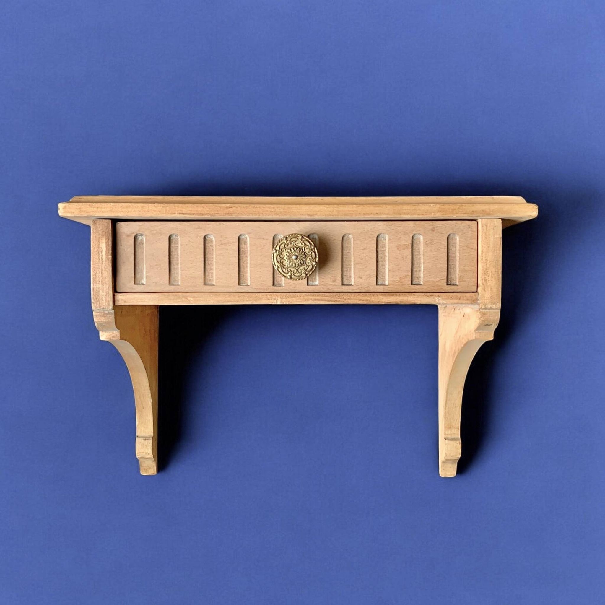 Old small hanging shelf in solid wood