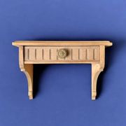 Old small hanging shelf in solid wood
