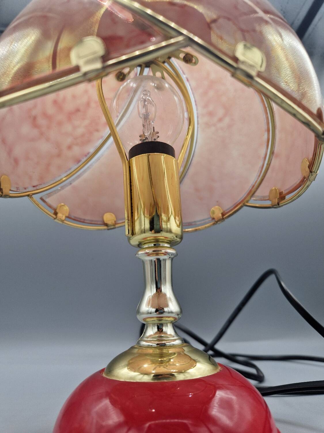 Vintage pink glass globe lamp with brass details and pink base