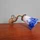 Wall light in gilded bronze and blue and white speckled glass