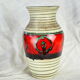 Frieze vase with green and red round