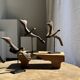 Traditional Indonesian decorative wooden bird on a base, crest model.